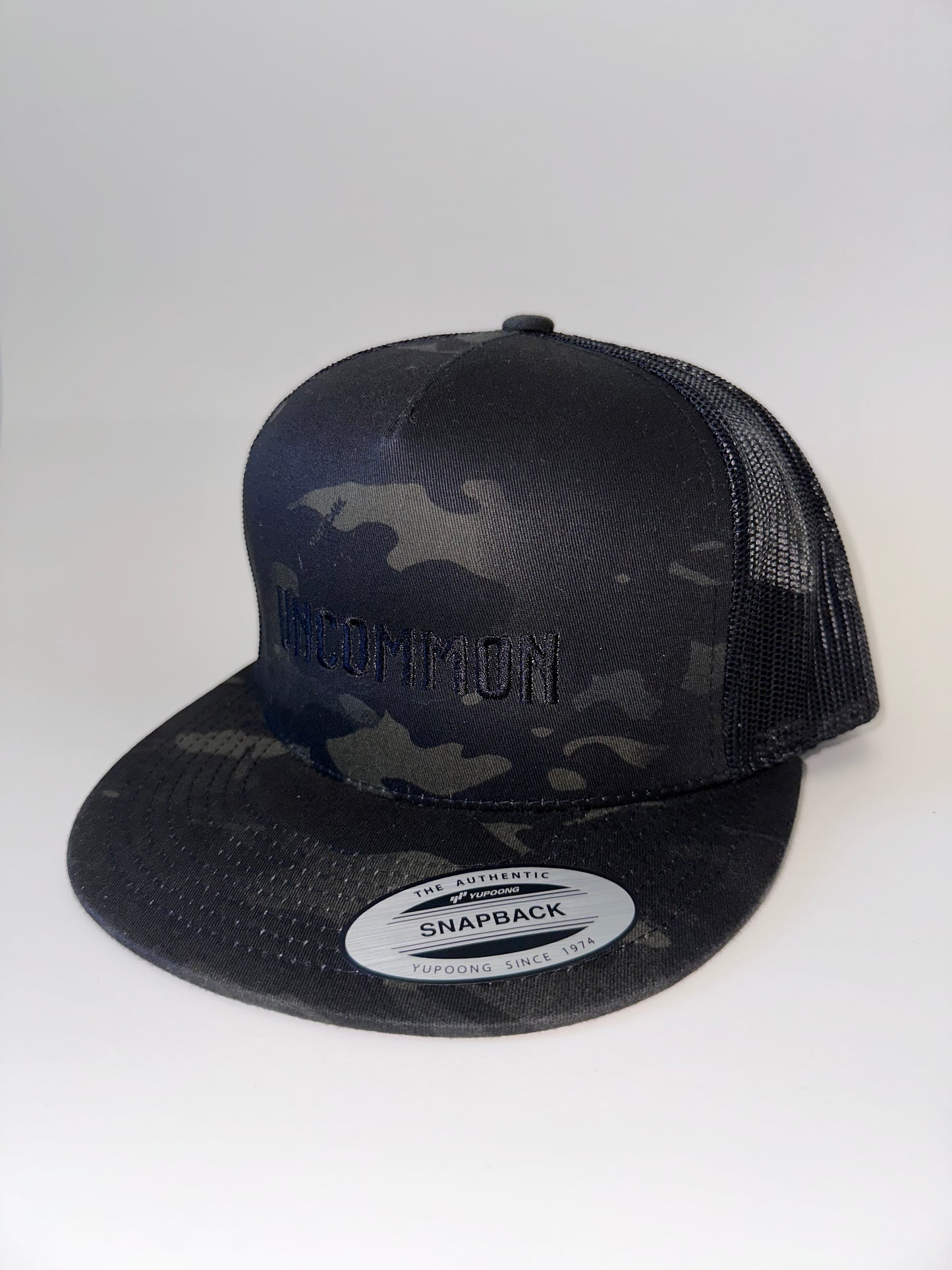 Classic Flat Bill Trucker Hat - Camo UNCOMMON